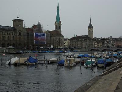 Wednesday 2009-03-25 &nbsp;&nbsp;Zurich Switzerland  We cross the Limmat to the Eastern side. The church steeples belong to the Fraukirche and the St Peterskirche. The building being renovated is the Stadthaus (Town house) and it contains various government offices. The renovations were completed in 2010.