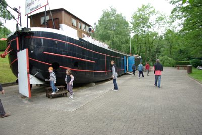 Sunday 13 June, 2010  We get off the tourist boat at the top and visit this old barge which is now a museum. Inside the barge are photographs of the original lock system. Interesting though is that when the photographs began in 1904, the description accompanying each picture was in German as Alsace & Lorraine were part of Germany at the time. In 1918 the comments changed to French and then back to German in 1940.