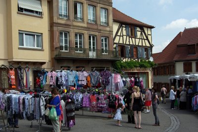 Monday 14 June, 2010  Markets don't do very much for me. The only interesting thing in this picture  is the juxtaposition of the ancient half-timbered building with a satellite receiver attached. : 2010-06-14 Strasbourg