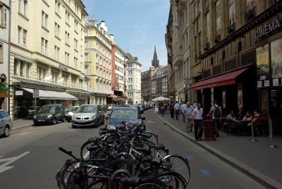 Monday 14 June, 2010  The car lane and the bicycle lane are separated by parking bays. How good is that? The tower of the Cathedral is visible in the distance. : 2010-06-14 Strasbourg