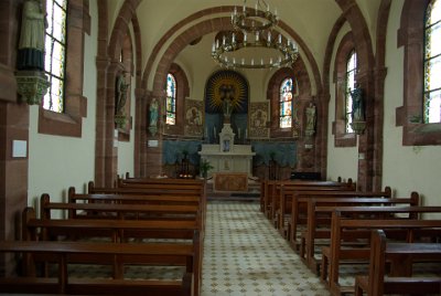 Wednesday 16  June, 2010  The chapel is small but very elegant. The front walls are adorned with statues of the virgin and child and my uniformed guess is that the statue of the man, centre left, is a carpenter named Joseph. : 2010-06-16 Rocher of Dabo