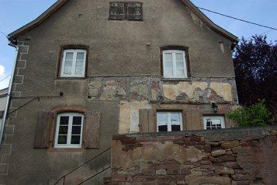 Tuesday 6 July, 2010 &nbsp;  I thought this was incredibly interesting. The building was originally constructed in the half-timbered style but plastered over. As exposing the timber is now in vogue, this building has had some of the plastering removed as a first step towards restoring it in the half-timbered style. : 2010-07-06 Romanswiller