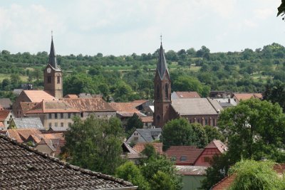 Tuesday 6 July, 2010 &nbsp;  We are standing on a hill near Michele's place looking down into Romanswiller. These are the two Christian churches: Catholic on the right and Protestant on the left. : 2010-07-05 JGR BLACK FOREST