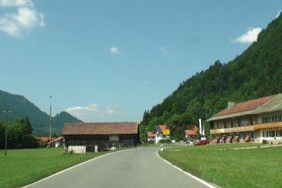 Friday 25  June, 2010  Some of the villages along the way are little bigger than a barn and a few buildings. This is Bäcker. The yellow sign means 50km through the village. : 2010-06-25 JGR Mittenwald