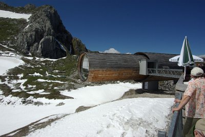 Friday 25  June, 2010  The round building, the     Nature information center "Karwendel Alps"     is open today, but with it hanging 7 feet over the edge, I decided there was nothing inside that I wanted to see. We were here only five days ago and it was snowing, now the sky is a brilliant dark blue. : 2010-06-25 Mittenvald