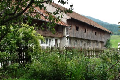 Monday 21  June, 2010  Something interesting: in a traditional farm house like this, the main residence always faces east while the barn and the animals get the western portion. I think it is to take advantage of the morning sun during the short days of winter. The animals live in the lower stone portion of the barn during winter and hay is stored in the upper portion. : 2010-06-21 JGR Munich