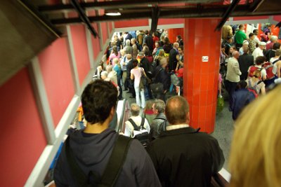 Thursday 24  June, 2010  Jenni asked a young German lad what was happening and he told her that passengers were advised to catch the U-bahn system to Holzkirchen and then to change trains for Bad Tölz. He agreed to show us the way. That is his head in the picture as we go down the subway escalator. : 2010-06-24 Munich