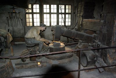 Saturday 3 July, 2010 Metals - Scythe forge and the Siegerland blast furnace  The scythe forge is used to shape and strengthen, a process called forging. Circa 1800 the hammer was driven by a waterwheel. The smith's seat is suspended from the rafters to reduce the effects of the vibrations from the hammer blows. : 2010-07-03 Munchen-bonfire