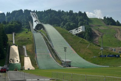 Thursday 1 July, 2010  The ski-jump hill was upgraded in 1978 and again in 2007 to meet the changing requirements of the International Skiing Federation (FIS). An international architectural competition in autumn 2006 led to the construction of the new  cantilevered (supported on one end) structure on the right. : 2010-07-01 partnach-lindenberg