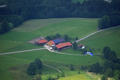 Wednesday 23  June, 2010  A para-glider rides the updrafts near Barbara's guest house. I hope the pilot has a car parked below. : 2006-06-23 Bavarian Alps