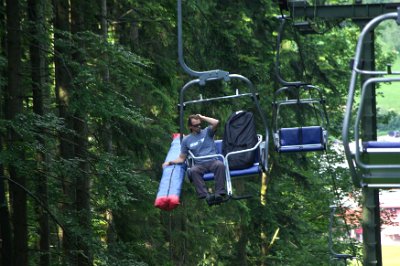 Wednesday 23  June, 2010  Here's a funny story. When we left the Blombergbahn station at the top, the operator stopped the lift so that we could get on. He then placed a metal flag on our chair and we figured out that this probably meant "Old farts on board".   Sure enough, at the bottom, the operator stopped the lift so that we could get off. Such are the perils of travel with an older woman. : 2006-06-23 Bavarian Alps