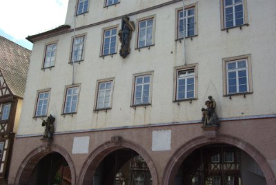 Sunday 4 July, 2010 35th wedding anniversary  This is the Calw Rathaus (Town Hall). The figures date from 1929 and symbolise the three major obligations of the city to its citizens:   Knight figure: protection and justice  A tree is planted: roots and thus flowering of the community   Mother with children: care for troubled in need.   The benches of  the bakers and butchers were situated under the arcades of the City Hall. : 2010-07-05 Black Forest