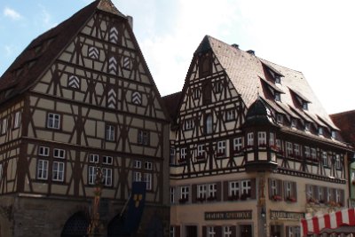 Tuesday 13 July, 2010 &nbsp;  The "Jagstheimer House", now occupied by the Marien apotheke, was built in 1488 for Mayor Jagstheimer.   The house has a decorative half-timbered gable with a picturesque oriel (the bit sticking out) and a scenic courtyard containing richly ornamented gallery balustrades.  It is located next to the Meat and Dance house on the southern end of the market square. : 2010-07-14 JGR CLAUS