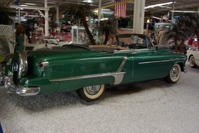 Wednesday 14 July, 2010  1953 Oldsmobile Rocket 98   We enter the first of two halls into the area called "American Dream Cars". These cars came from a time when Detroit's cars were the envy of the world. In Europe ordinary people were driving Citroen 2CVs and Fiat 500s. How sad that after decades of mismanagement General Motors became Government Motors.  This car, the 1953 Rocket 98, was the top of the line model and it had a 5 litre V8 with a 4 speed auto transmission. : 2010-07-13 Claus