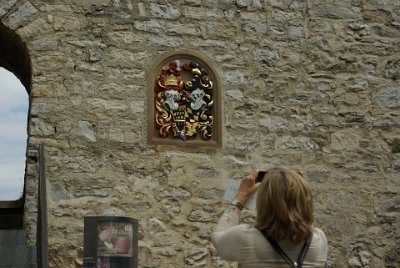 Thursday 15 July, 2010 &nbsp;  I take a photo of Jenni taking a picture of an heraldic emblem.  It's not the emblem of Baden-Württemberg nor Swabia so my guess is that it's something to do with the von Neuffen family. : 2010-07-16 Claus