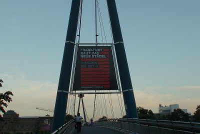 Friday 16 July, 2010 &nbsp;  We crossed back over the river to our hotel. The German words are something about building a new barn. : 2010-07-16 JGR FRANKFURT RETURN