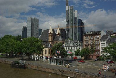 Saturday 12 June, 2010  The yellow building is the Erziehungsberatungsstellen; an education and family counselling centre. Behind it is the Commerzbank Building, at 259 m the EU's tallest building. Frankfurt is one of only three cities in the EU that have a significant number of skyscrapers, the others being London and Paris. : 2010-06-13 Frankfurt