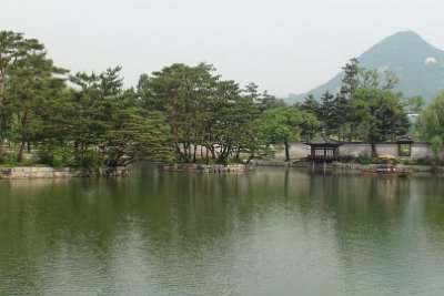 Thursday 10 June, 2010  Three stone bridges connect the building to the palace grounds, and corners of the balustrades around the island are decorated with sculptures of the twelve Zodiac animals. : JGR Korea