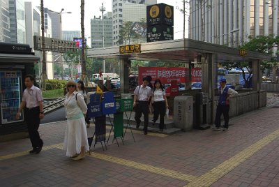 Thursday 10 June, 2010  Very near to our hotel is a metro station. If you cannot read Korean, then all you need to know is that this is Euiljero-1 station on the green line. Jenni is standing at exit 6 and there are eight exits in all, one on each corner of both streets. : Seoul