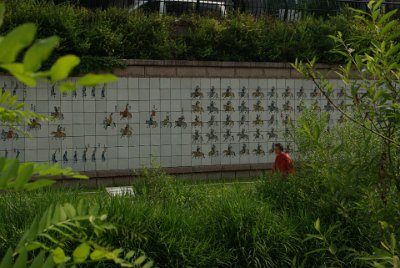 Thursday 10 June, 2010  The tiles on the wall opposite tell the tale of an ancient battle. : Seoul