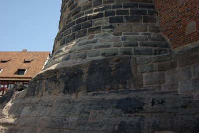 Monday 12 July, 2010 &nbsp;  The blackening of the stones from fires burning during the bombing runs, that destroyed much of the complex during WWII, are visible on the foundations of the Sinwell Tower. : 2010-07-12 Nurnberg