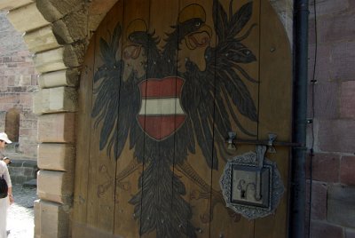 Monday 12 July, 2010 &nbsp;  View through the inner gate from the inner courtyard where the palas is situated. Note the Imperial Banner of Frederick III  (1437–1493) on the gate.  The Palas is the main representative building of the castle and was the centre of imperial power. Apart from the repair after the destruction of  World War II,  the current gothic building remains unchanged since being built in 1440-1442. : 2010-07-12 Nurnberg