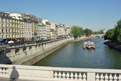 Thursday 8 July, 2010 &nbsp;  We cross Pont Saint-Michele and return to the left bank. Pont Saint-Michel links the Place Saint-Michel on the left bank to the Île de la Cité. It was named after the nearby chapel of Saint-Michel and the 62 metre long bridge dates to 1857. Pont Neuf is also visible in this picture. : 2010-07-08 Paris1