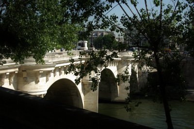 Thursday 8 July, 2010 &nbsp;  Once on the left bank, we drive beside the Seine. This is the Pont Neuf again connecting the left bank with the  Île de la Cité. The limestone from which the bridge is made was mined from deposits under the city itself. The blocks were cut to size underground and pulleyed to the surface. Limestone is made from the skeletons of dead sea creatures compressed over millions of years. This means that Paris was once at the bottom of a sea bed. : 2010-07-08 Paris1