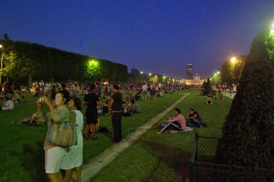 Thursday 8 July, 2010 &nbsp;  Huge crowds gathered on the Champ de Mars and we thought it was to escape the heat. Pests were still out  selling junk, this time a thing fired into the air that left a blue streak of light behind it. : 2010-07-08 Paris1