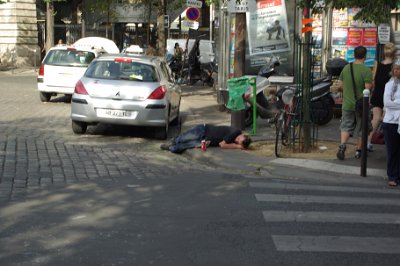 Friday 9 July, 2010 &nbsp;  The heat got to us so we returned to our hotel to rest. After a couple of hours recovering, we headed off again. A drunk sleeps peacefully, undisturbed, in the gutter. We catch a train to Cité Metro station on the  Île de la Cité. : 2010-07-09 Paris2