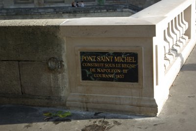 Friday 9 July, 2010 &nbsp;  We walk from the Cité Metro station to the Seine and turn left without crossing the bridge. The Pont Saint-Michel links the Place Saint-Michel on the left bank of the Seine to the Île de la Cité and it was named after the nearby chapel of Saint-Michel. The 62-metre-long bridge dates to 1857. : 2010-07-09 Paris2