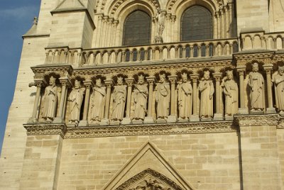 Friday 9 July, 2010 &nbsp;  The statue of Adam is above the balustrade, between the two windows. Eve occupies a similar position on the right window.  Under the balustrade is the Gallery of Kings, a row of twenty-eight statues that represents  twenty-eight generations of the kings of Judah, the descendants of Jesse and the human ancestors of Mary and Jesus. Mary was descended from royalty? How odd. : 2010-07-09 Paris2