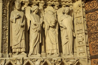 Friday 9 July, 2010 &nbsp;  On each side of the two main  doors, there are nine full-size statues.  These statues are on the left:  the Emperor Constantine (who took Rome into Christianity), an angel,    Saint Denis    holding his head, and another angel.  On the right are Saint John the Baptist, Saint Stephen, Saint Genevieve and Pope Saint Sylvester. : 2010-07-09 Paris2