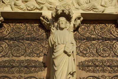 Friday 9 July, 2010 &nbsp;  On the trumeau (the column between the two doors) of the Portal of the last Judgement,  Christ is teaching, standing on a pedestal sculpted with the liberal arts.  The Portal of the Last Judgement was built in the 1220s-1230s, just after the façade’s other two portals and it represents the Last Judgement as described in the Gospel of Saint Matthew. : 2010-07-09 Paris2