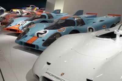 Thursday 17  June, 2010 1971 Porsche 917 KH Coupe  The two Gulf Oil 917's had  180° V12 turbocharged engines and a top speed of 360 km/h.  In the 1971 1000 km Spa-Francorchamps one of these set an average speed that probably will never be beaten: 249.069 km/h. The pink car behind is a 917/20 V12 called the "Pink Pig" . : 2010-06-17 JGR Stuttgart