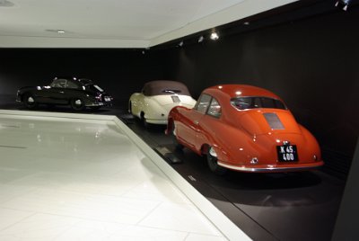 Thursday 17  June, 2010 1950 Porsche 356/2 Coupe (orange car) and 1948 356/2 Gmünd Cabriolet (White convertible)   Following WWII, the first Porsche cars are built in Gmünd Austria. Ferry Porsche develops the 356/2 from the 356/1  prototype and produces a small run of 52 coupes and 53 cabriolets. : 2010-06-18 stuttgart