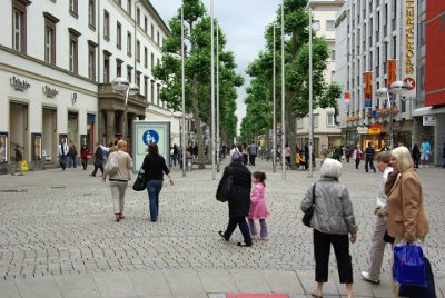 Friday 18,  June, 2010  Koenigstrasse, Stuttgart's pedestrian mall, at 1km long  is Germany's longest. Like many cities in Germany, what we see now is reconstructed from the ruins of WWII. I really like that  when they had the opportunity to reconstruct, they eschewed skyscrapers and got rid of cars from the city centres. : 2010-06-18 stuttgart