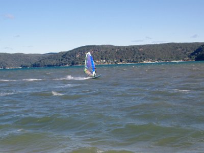 At the bottom of the hill at last, we walk back along the beach. The high winds are sailboard heaven. : anniversary no 36