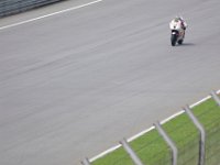 Friday 19 October 2012  Michele Pirro, Italy (51) rides his Gresini Honda down the back straight.  It is a CRT bike with a Honda street bike engine fitted to an FTR chassis made in England. : MotoGPMalaysiq