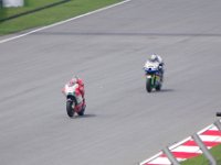 Friday 19 October 2012  Nicky Hayden, USA (69) rides a factory Ducati. Although he usually qualifies better than Rossi on the other Ducati, he does not score as well in the races.  The bike behind is a CRT ridden by Yonny Hernandez, Columbia (68). It is powered by a Kawasaki engine in an FTR chassis. : MotoGPMalaysiq