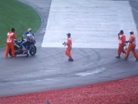 Saturday 20 October 2012  Then other marshals rush to his aid. : MotoGPMalaysiq