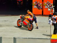 Sunday 21 October 2012   One of Casey's mechanics pushes his bike back into the garage : MotoGPMalaysiq