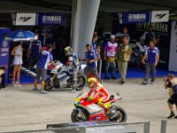 Sunday 21 October 2012   Rossi rides by as Jorge dismounts. Rossi must be looking at the Yamaha M1 green with envy. : MotoGPMalaysiq