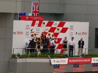 Sunday 21 October 2012  Handing out the trophies at the  Moto 2 podium ceremony.   Marquez and seven others crashed out while pole-sitter Pol Espargaro finished a lowly 11th. : MotoGPMalaysiq