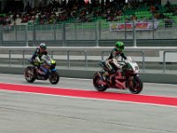 Saturday 12 October 2013 - Qualifying day   FP4 ends and Q1 begins 25 minutes later. The top two riders in this session progress to Q2 with the rest fliling the remaining grid postions (13-24)  according to the times they set in this session. Lukas Pesek and Michael Laverty exit the pits. : Sepang