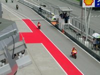 Saturday 12 October 2013 - Qualifying day  Riders return to the pits to change tyres. They are being lead by Marc Marquez and Dani Pedrosa. : Sepang