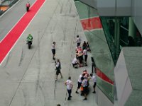 Saturday 12 October 2013 - Qualifying day  Andrea Dovizioso and Alvaro Bautista rejoin while  Dani Pedrosa gets a stop signal from one of the crew. The crew does not want their two riders to crash into each other. : Sepang