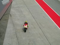 Saturday 12 October 2013 - Qualifying day  Andrea Iannone comes in for a tyre change. : Sepang