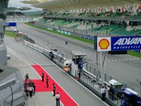 Saturday 12 October 2013 - Qualifying day  Aleix Espargaro pulls a wheelie as he receives the checkered flag. : Sepang