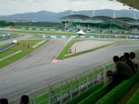 Sunday 13 October 2013 - Race day  When we arrive at the circuit, Moto3 morning warmup is under way. It had rained overnight and the track was damp in patches which caused this excursion at turn 14. : Sepang